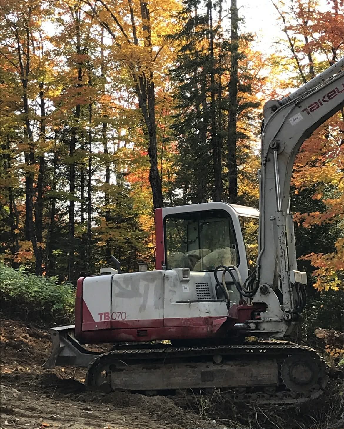 Takeuchi excavator in fall colours in the Laurentians